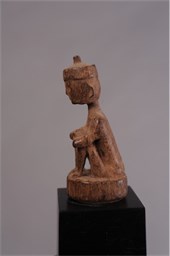 EARLY SEATED FIGURE BAMBOO STOPPER